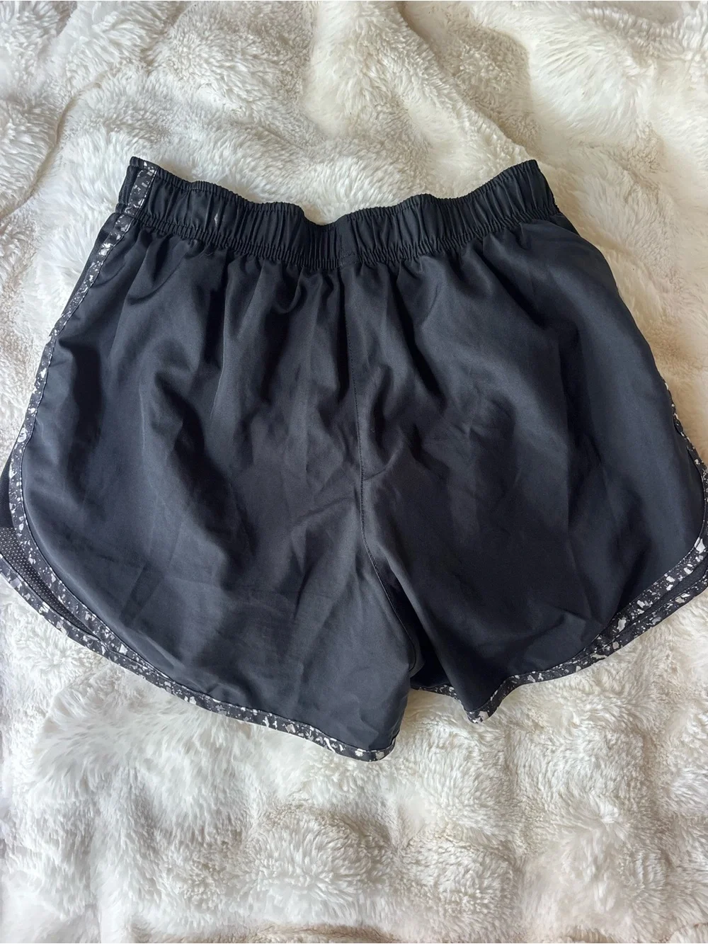 Nike Black Athletic Shorts with White Swoosh and Speckled Trim